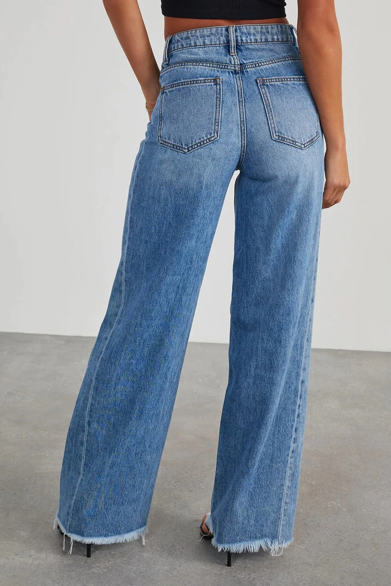 Mid-waisted Raw Edge Hem Jeans